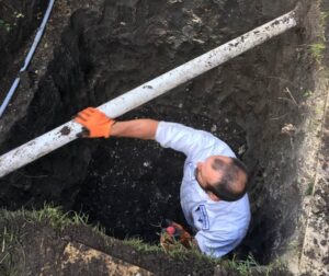 Plumber repairing a slab leak in Fort Worth