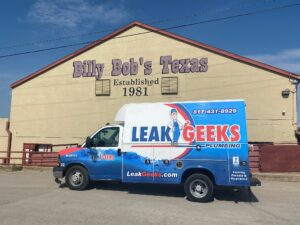 Leak Geeks plumbing van in front of Billy Bob's in Fort Worth