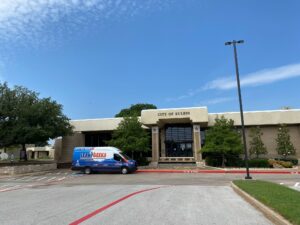 Leak Geeks plumbing van in front of Euless City Hall