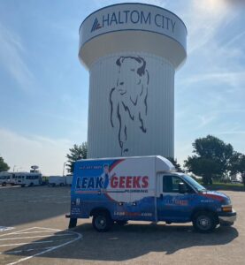 Leak Geeks plumbing van in front of the Haltom City water tower