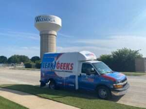 Leak Geeks plumbing van in front of the Watauga water tower