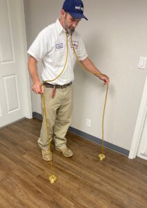 Plumber looking for a water leak using leak detection