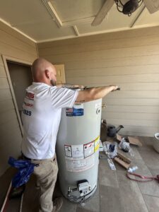 Leak Geeks technician installing a water heater