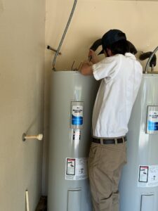 Leak Geeks plumber connecting a new electric water heater in Fort Worth