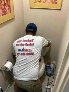 Plumber completing a toilet repair in Fort Worth