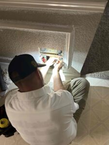 Plumber repairing a water leak in a wall in Fort Worth